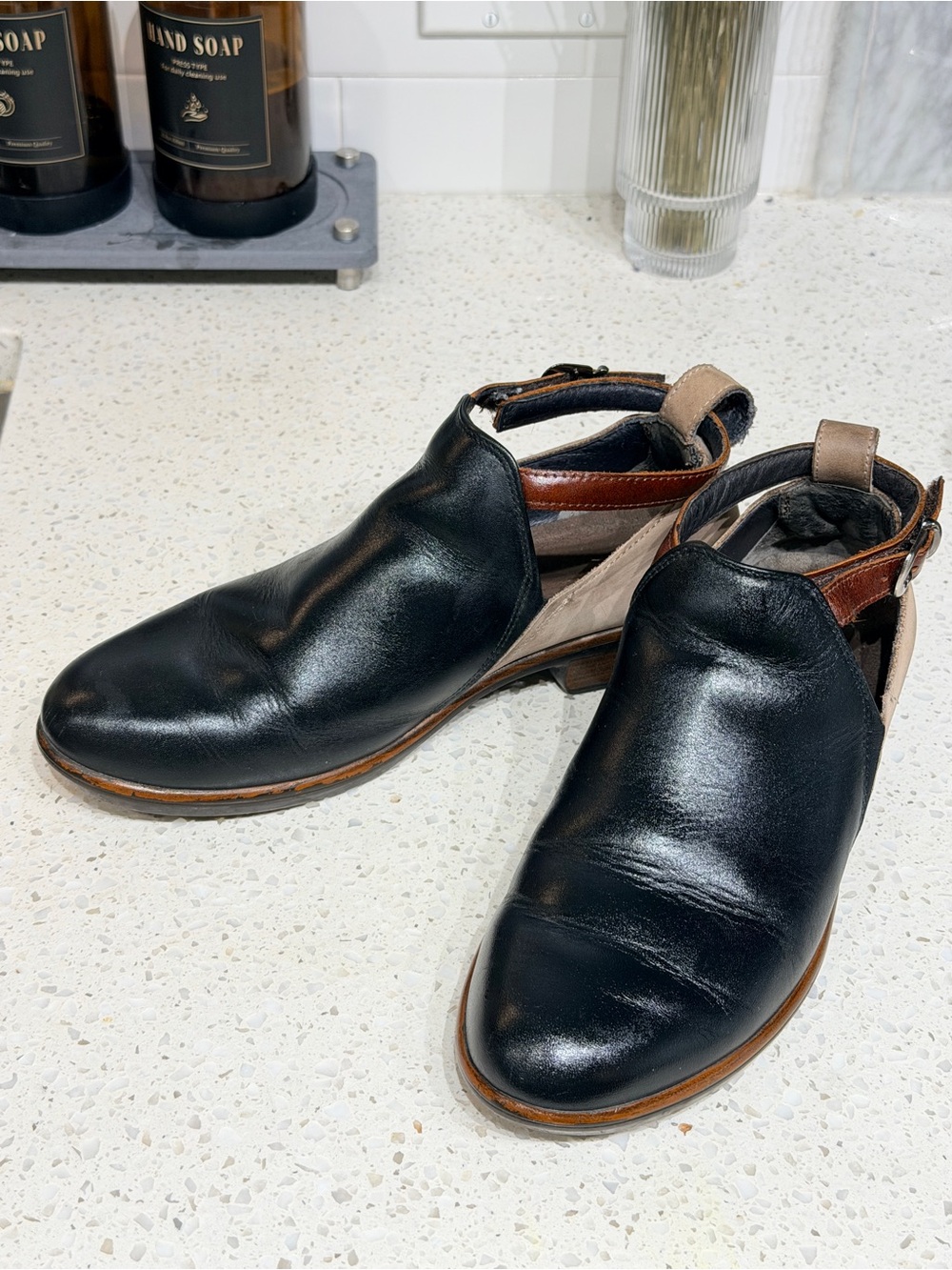 Naot Black and Tan Leather Cutout Ankle Booties